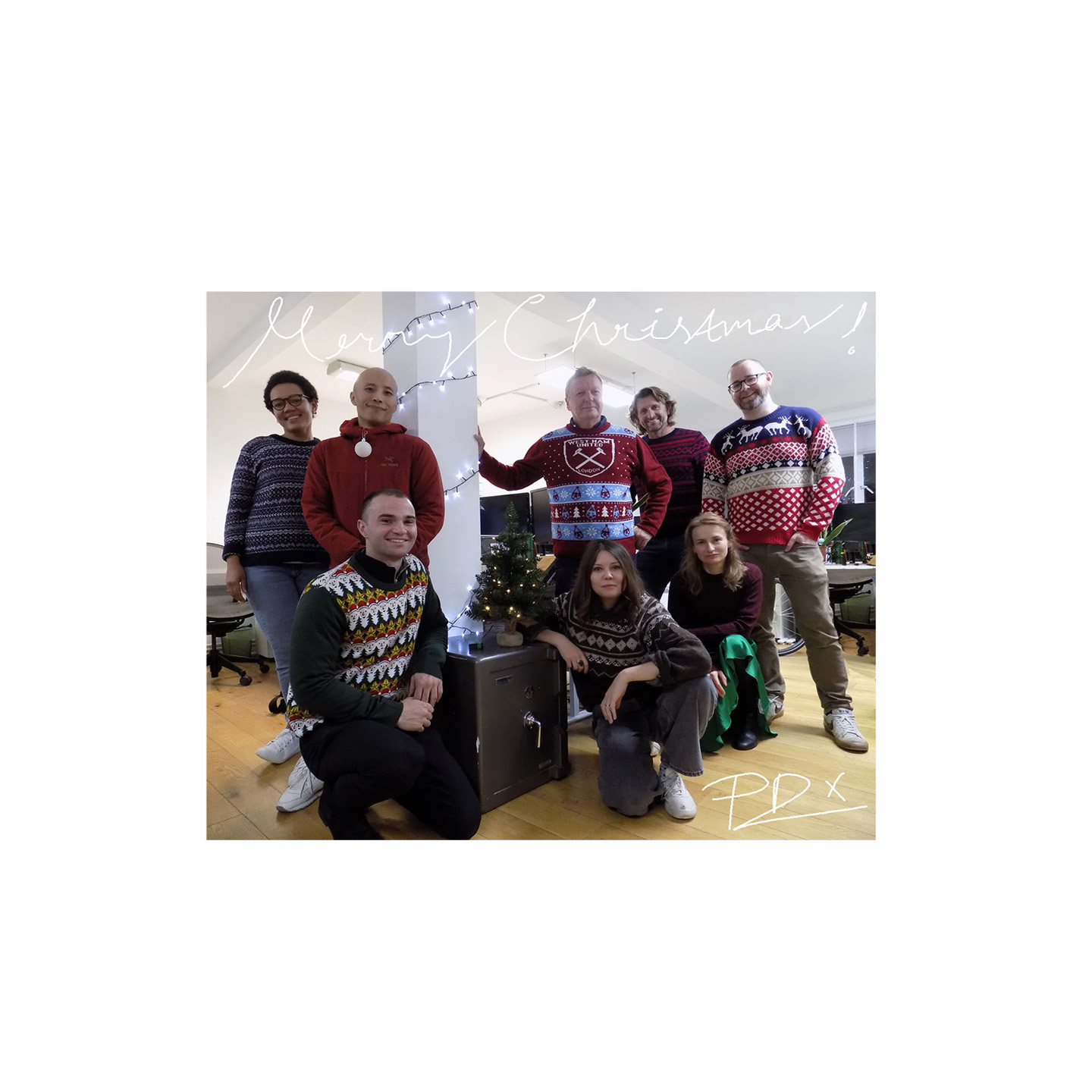 Staff at Peter Dann in the london office wearing christmas jumpers