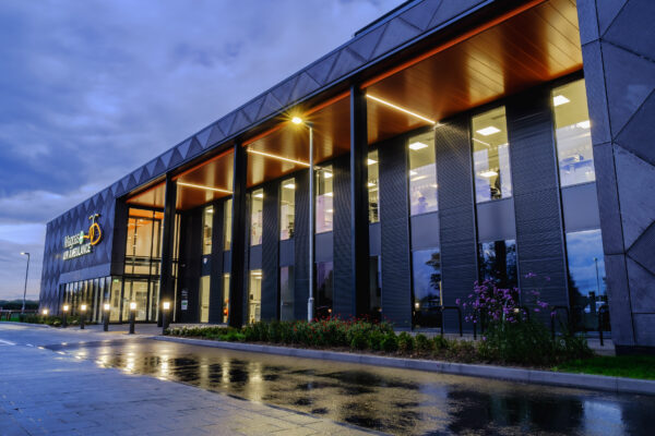 Magpas Air Ambulance headquarters exterior lit up at dusk