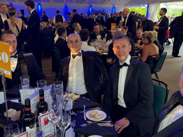 BCSA Dinner Night showing staff in black tie at round dinner table