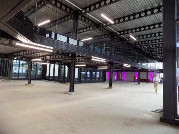 Internal floor of HUB Victoria showing black steelwork and concrete flooring