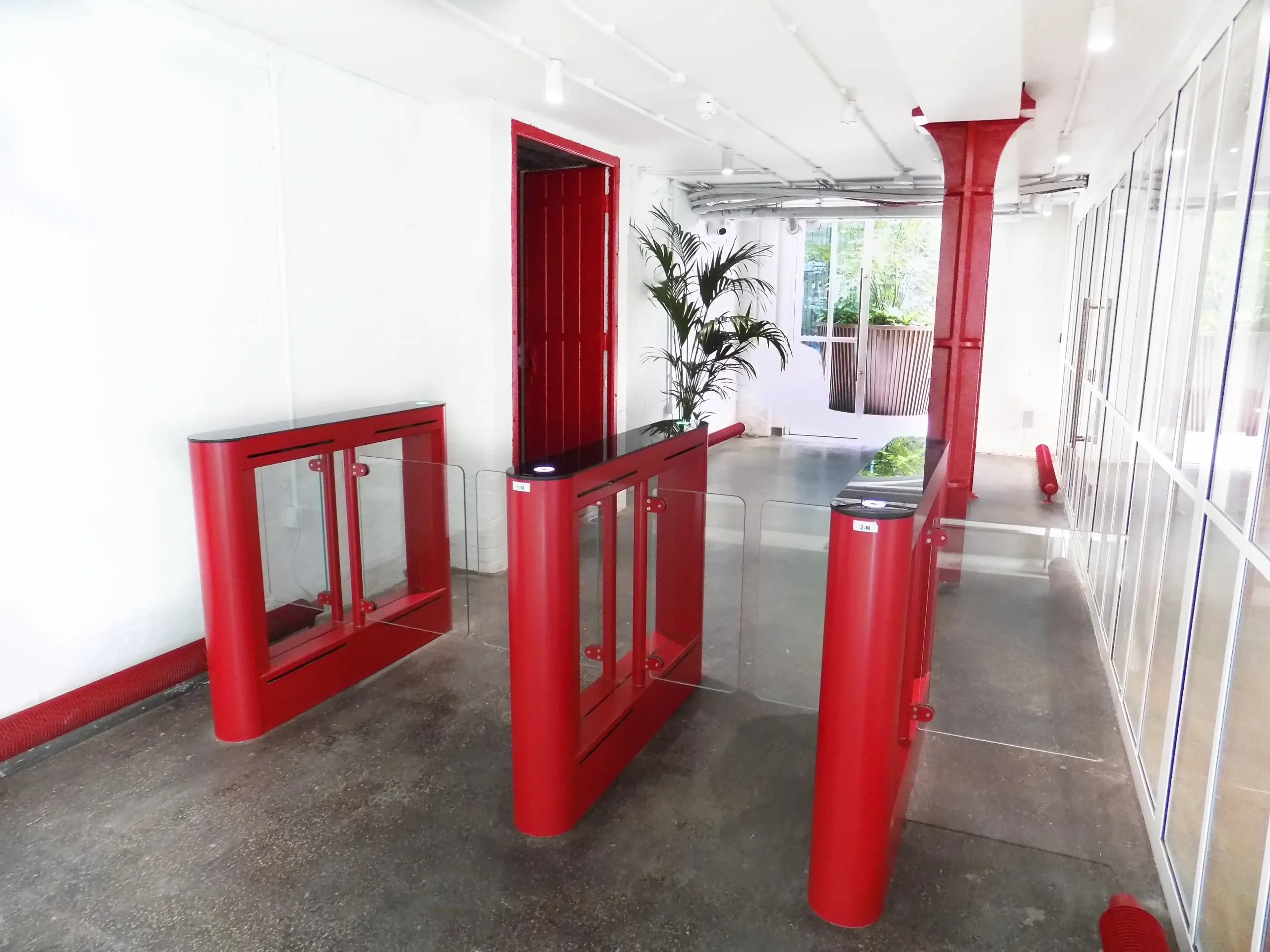 The Heal's Building Interior entry red barriers to workspace and internal courtyard with red steel column