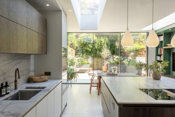 Interior view looking out to garden through an open-plan kitchen