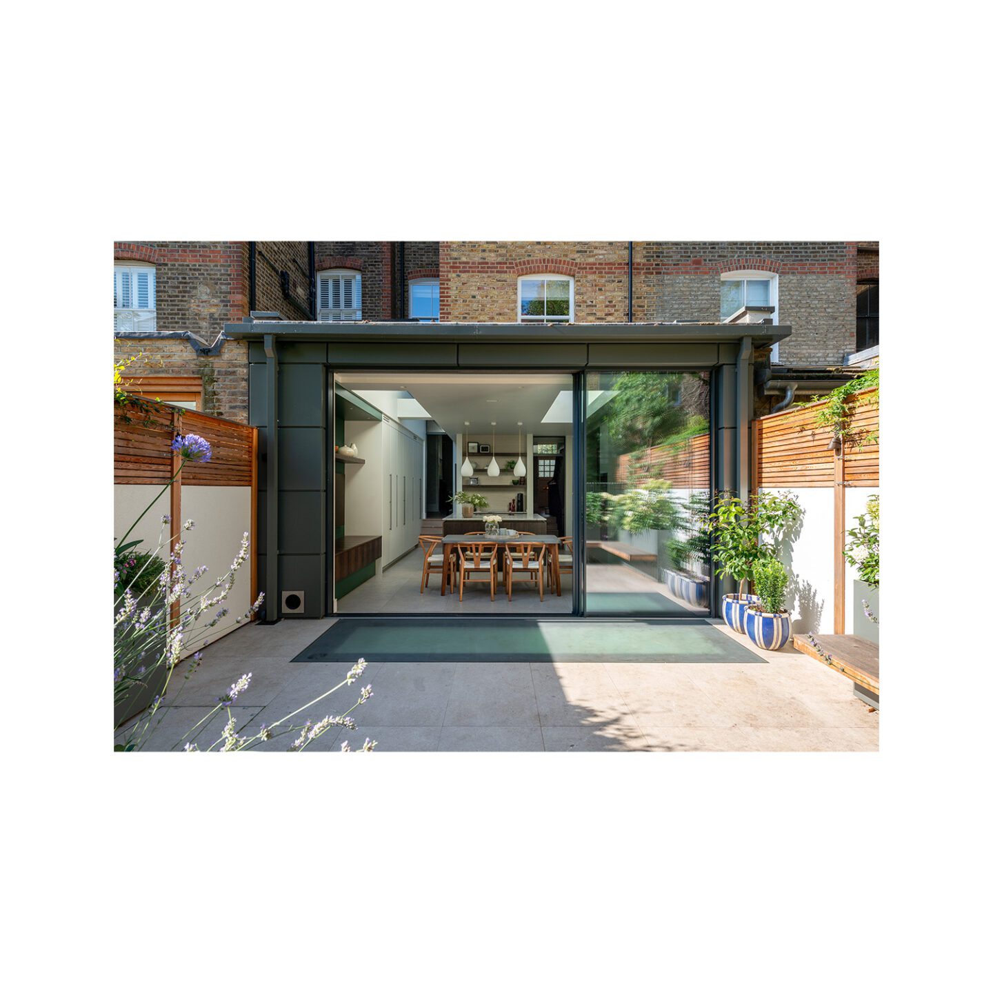 rear residential extension on mid-century terrace with sliding glass door