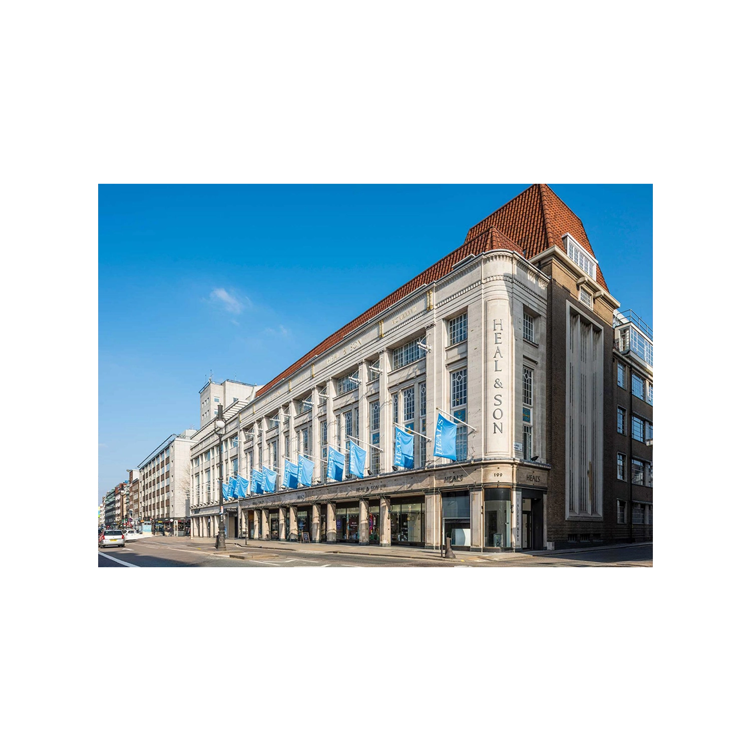 Heals building exterior under blue sky on Tottenham Crt Road