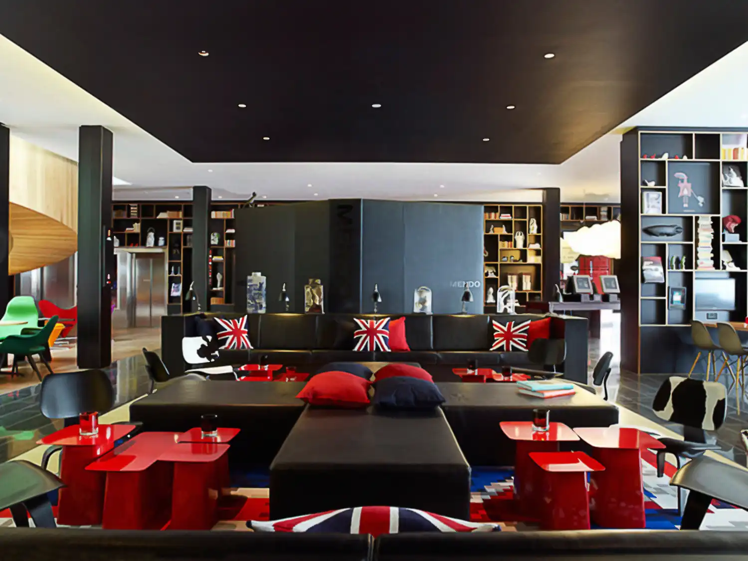 Interior of modular hotel with union jack cushions and black metal columns