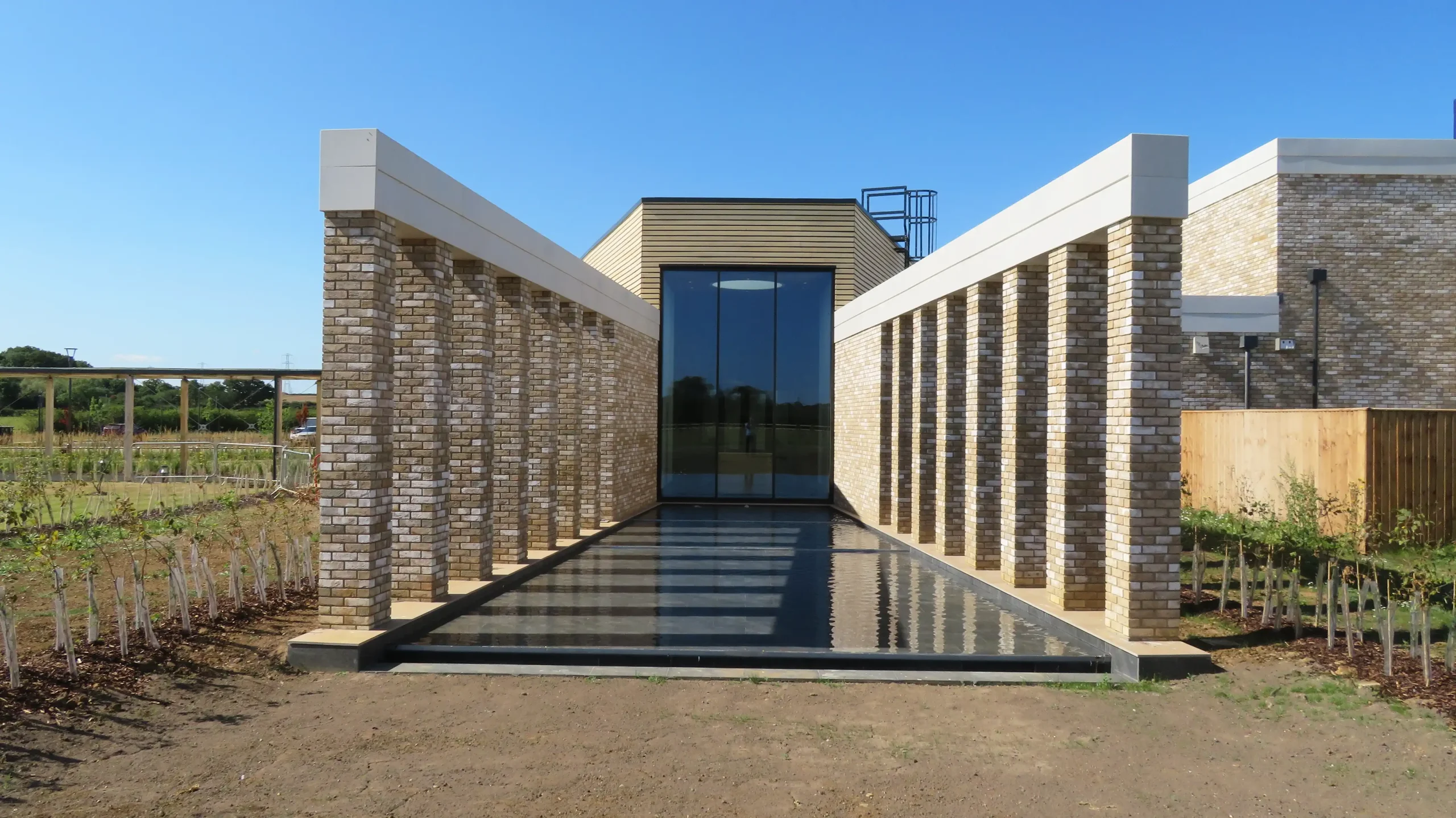 Crematorium avenue of columns either side of a running water feature pathway