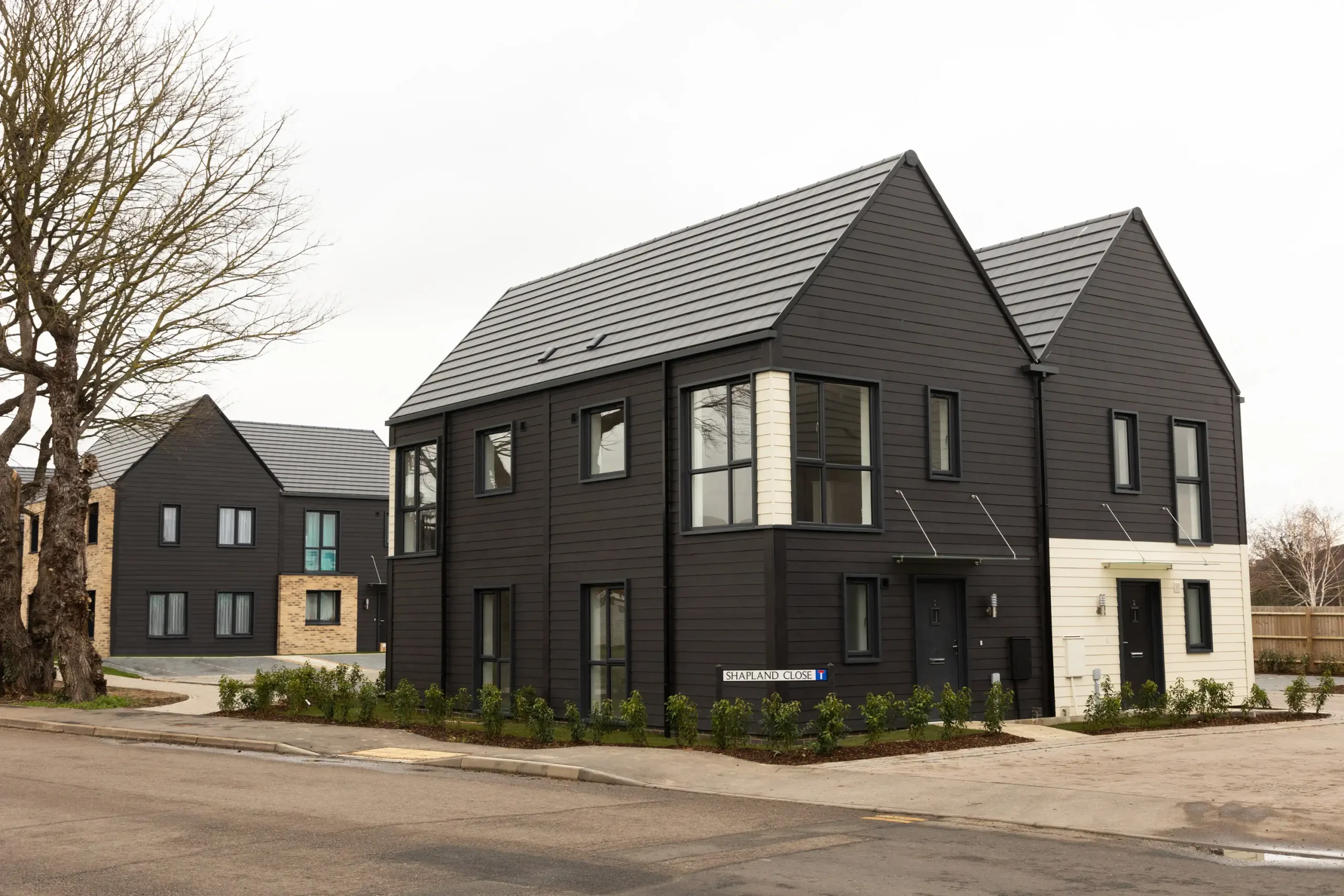 black and white panelled houses with gable roofs on california road