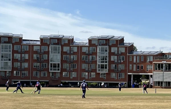 Peter Dann staff at a sunny cricket match in Cambridge