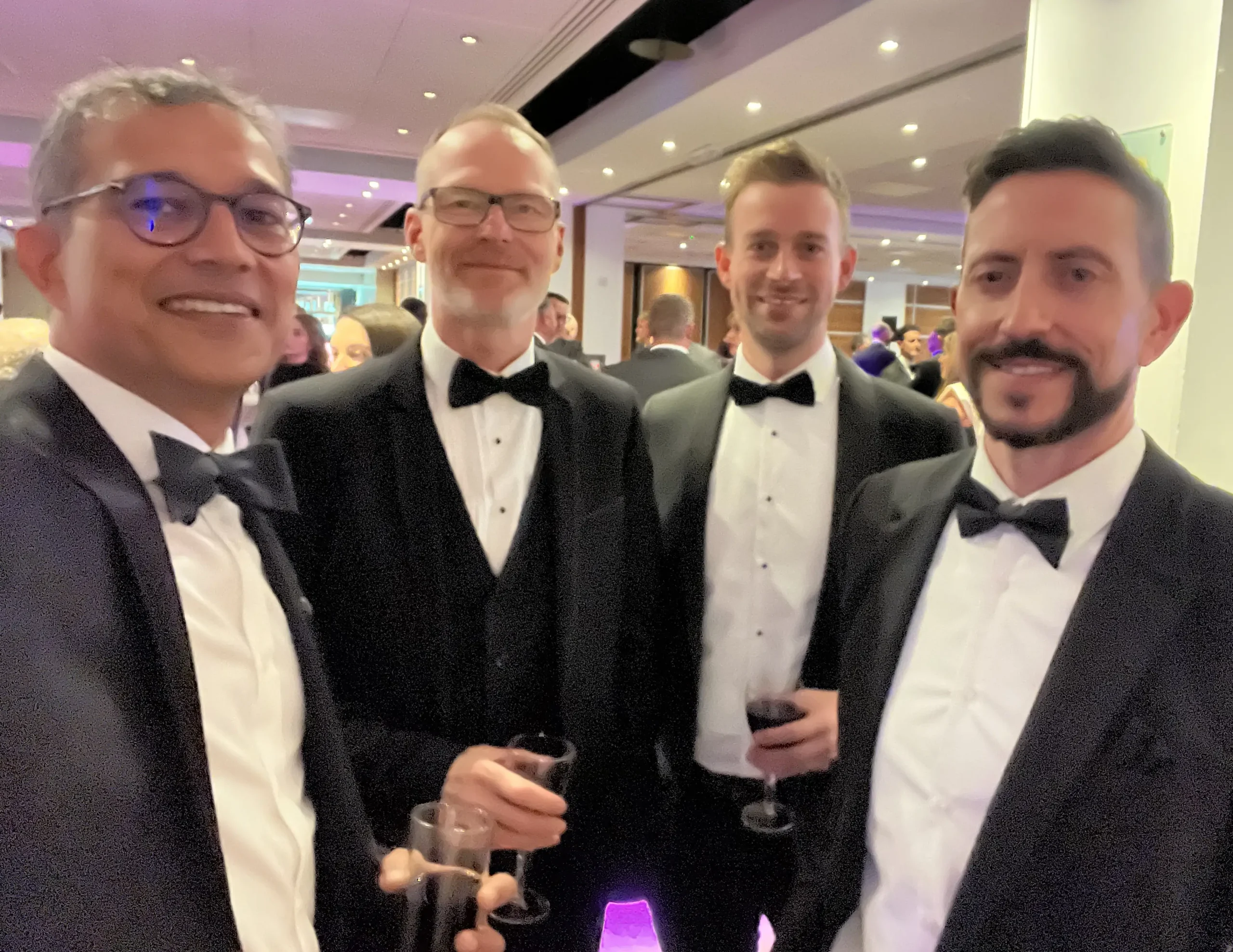 Four black-tie attired structural engineers and architects at the London Construction awards night 2025