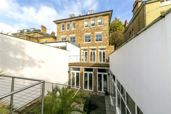 View of rear property showing descent into lower-ground and basement