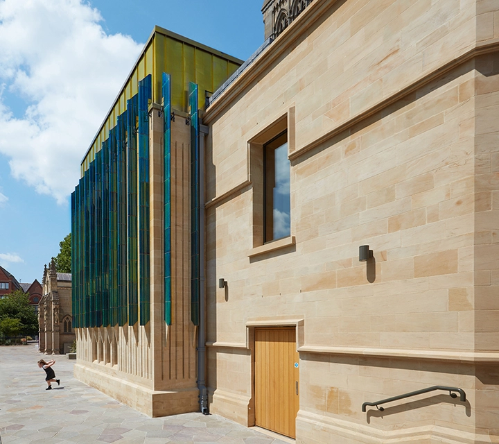 Leicester Cathedral Heritage and Learning Centre Extension exterior view angle showing fins in sunlight