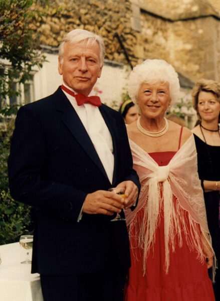 Company founder Peter Dann at Jubilee ball with wife in black tie