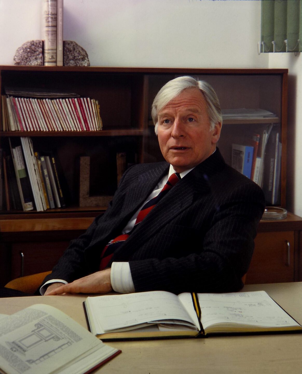 Found Peter Dann at his desk