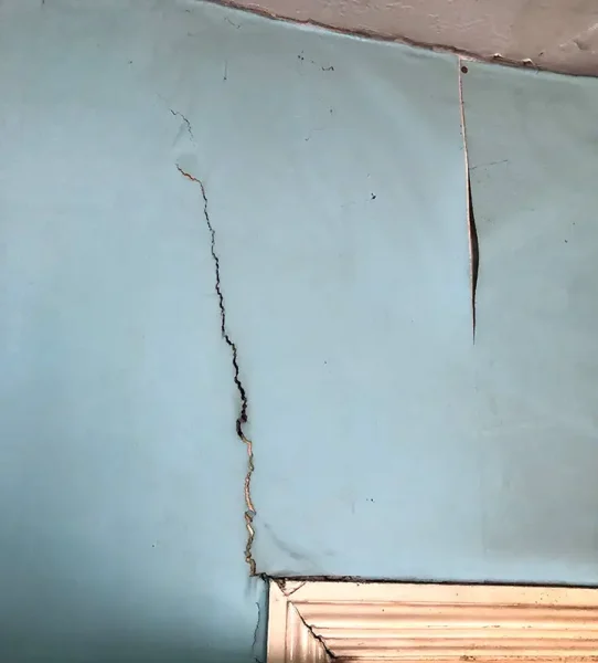 diagonal crack above door corner