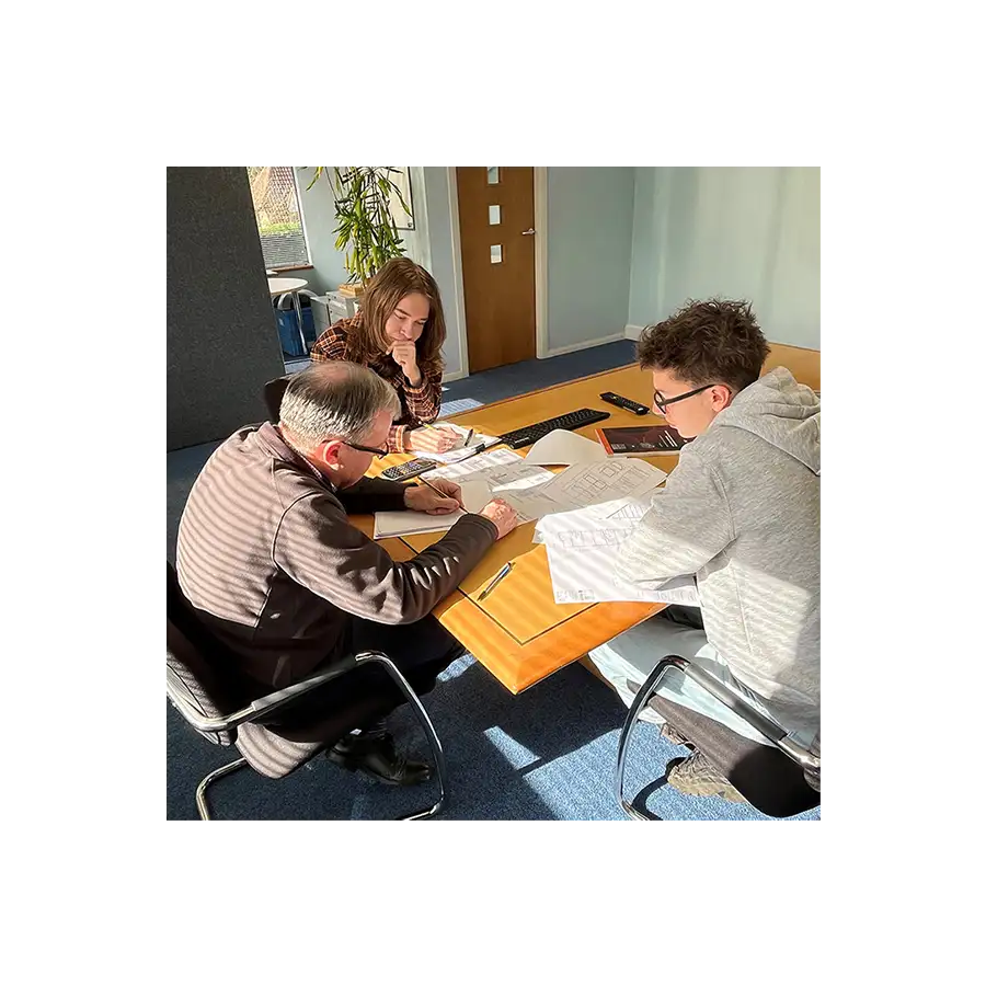 Senior engineer with apprentices